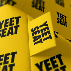 A vibrant Yeet Seat logo on a bean bag side.