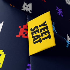 A vibrant Yeet Seat label on a bean bag side