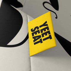 A vibrant Yeet Seat label on a bean bag side
