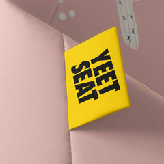 A vibrant Yeet Seat label on a bean bag side