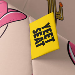 A vibrant Yeet Seat label on a bean bag side