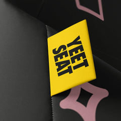 A vibrant Yeet Seat label on a bean bag side