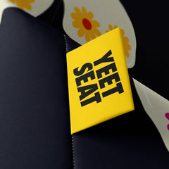 A vibrant Yeet Seat label on a bean bag side