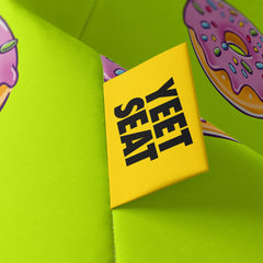A vibrant Yeet Seat label on a bean bag side