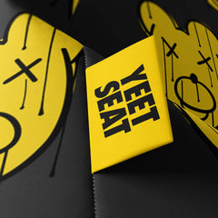 A vibrant Yeet Seat label on a bean bag side