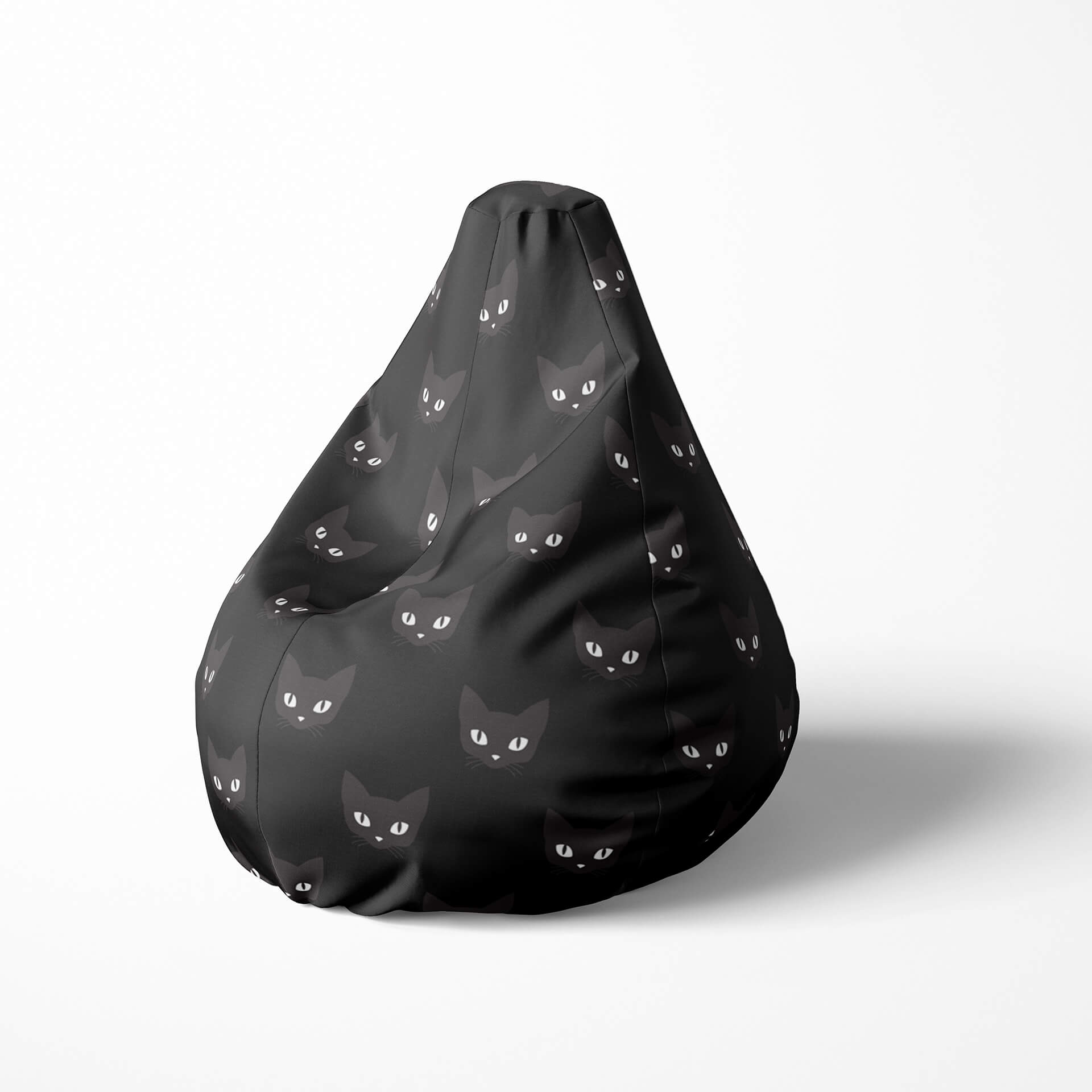 Left image of a beanbag with black cat faces on a dark background.