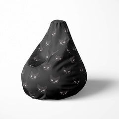 Left image of a beanbag with black cat faces on a dark background.