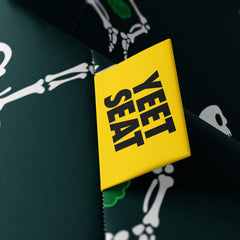 A vibrant Yeet Seat label on a bean bag side