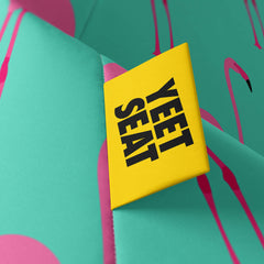 A vibrant Yeet Seat label on a bean bag side