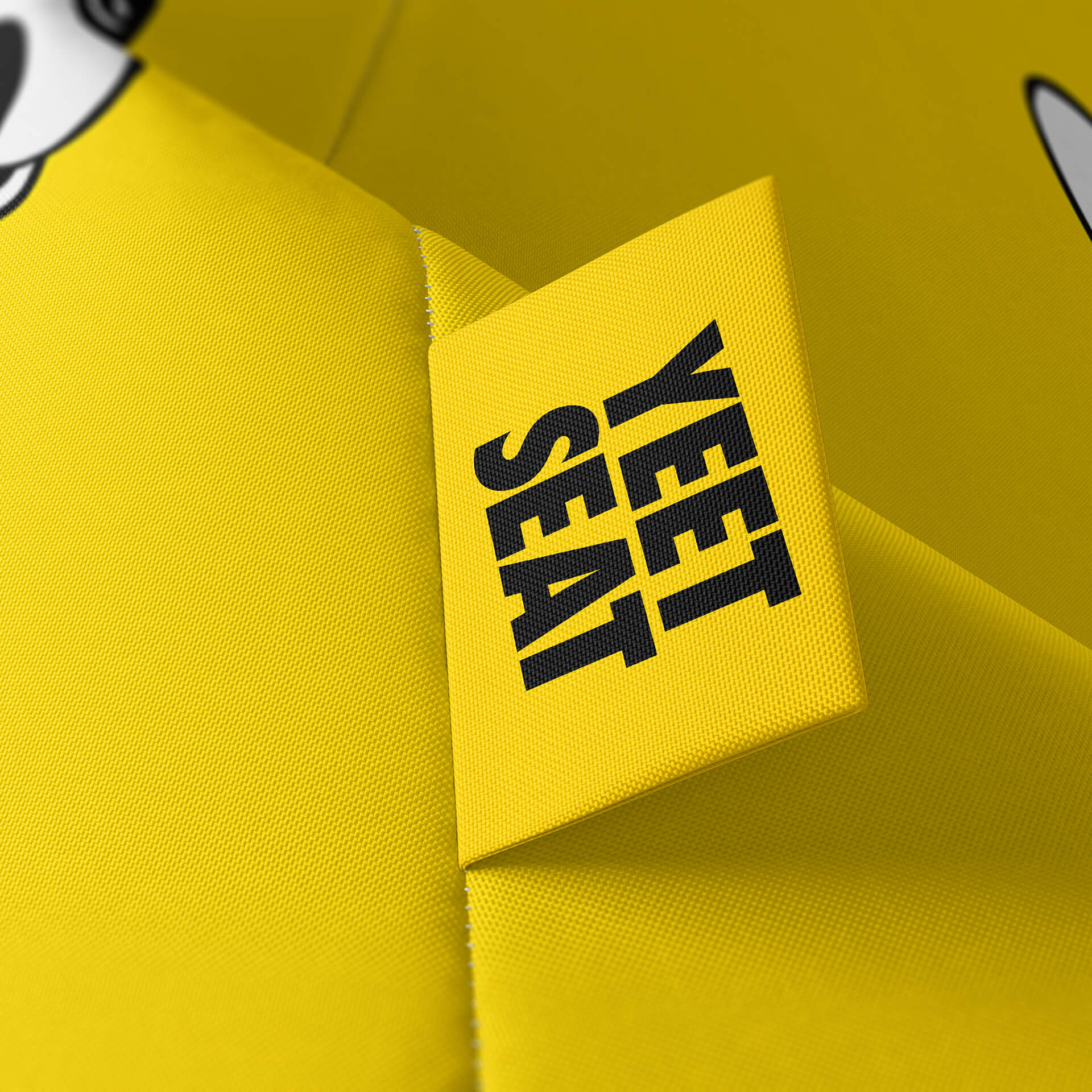 A vibrant Yeet Seat label on a bean bag side