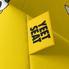 A vibrant Yeet Seat label on a bean bag side