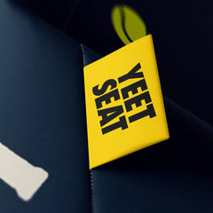 A vibrant Yeet Seat label on a bean bag side.