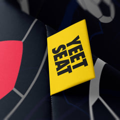A vibrant Yeet Seat label on a bean bag side.