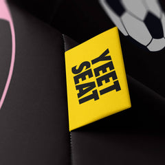 A vibrant Yeet Seat label on a bean bag side.