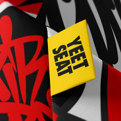 A vibrant Yeet Seat label on a bean bag side