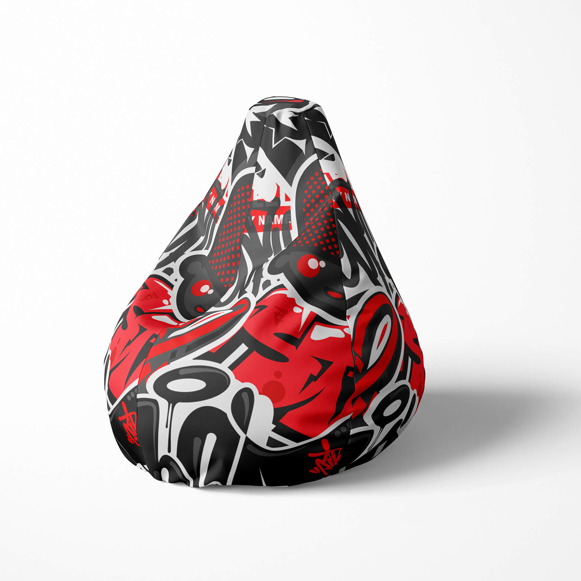 Left image of a beanbag with bold red, black, and white graffiti-style design.
