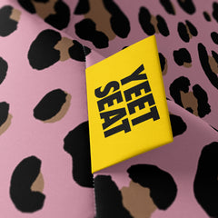 A vibrant Yeet Seat label on a bean bag side