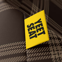 A vibrant Yeet Seat label on a bean bag side.