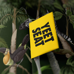 A vibrant Yeet Seat label on a bean bag side