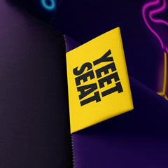 A vibrant Yeet Seat label on a bean bag side
