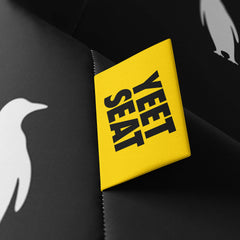 A vibrant Yeet Seat label on a bean bag side