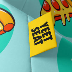A vibrant Yeet Seat label on a bean bag side