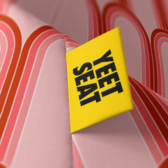 A vibrant Yeet Seat label on a bean bag side