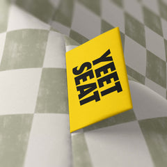 A vibrant Yeet Seat label on a bean bag side.