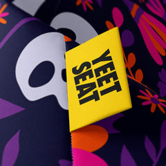 A vibrant Yeet Seat label on a bean bag side