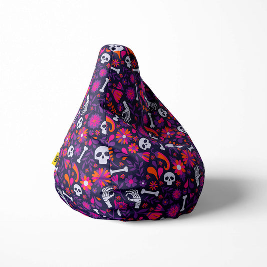 Right image of a beanbag with skulls, flowers, and bones on a purple background.