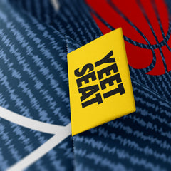 A vibrant Yeet seat label on a bean bag side.