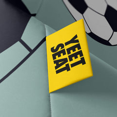 A vibrant Yeet Seat label on a bean bag side