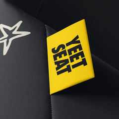 A vibrant Yeet Seat label on a bean bag side