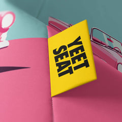 A vibrant Yeet Seat label on a bean bag side.