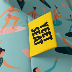 A vibrant Yeet Seat label on a bean bag side