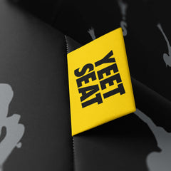 A vibrant Yeet Seat label on a bean bag side.