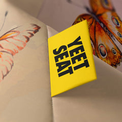 A vibrant Yeet Seat label on a bean bag side.