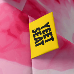 A vibrant Yeet Seat label on a bean bag side