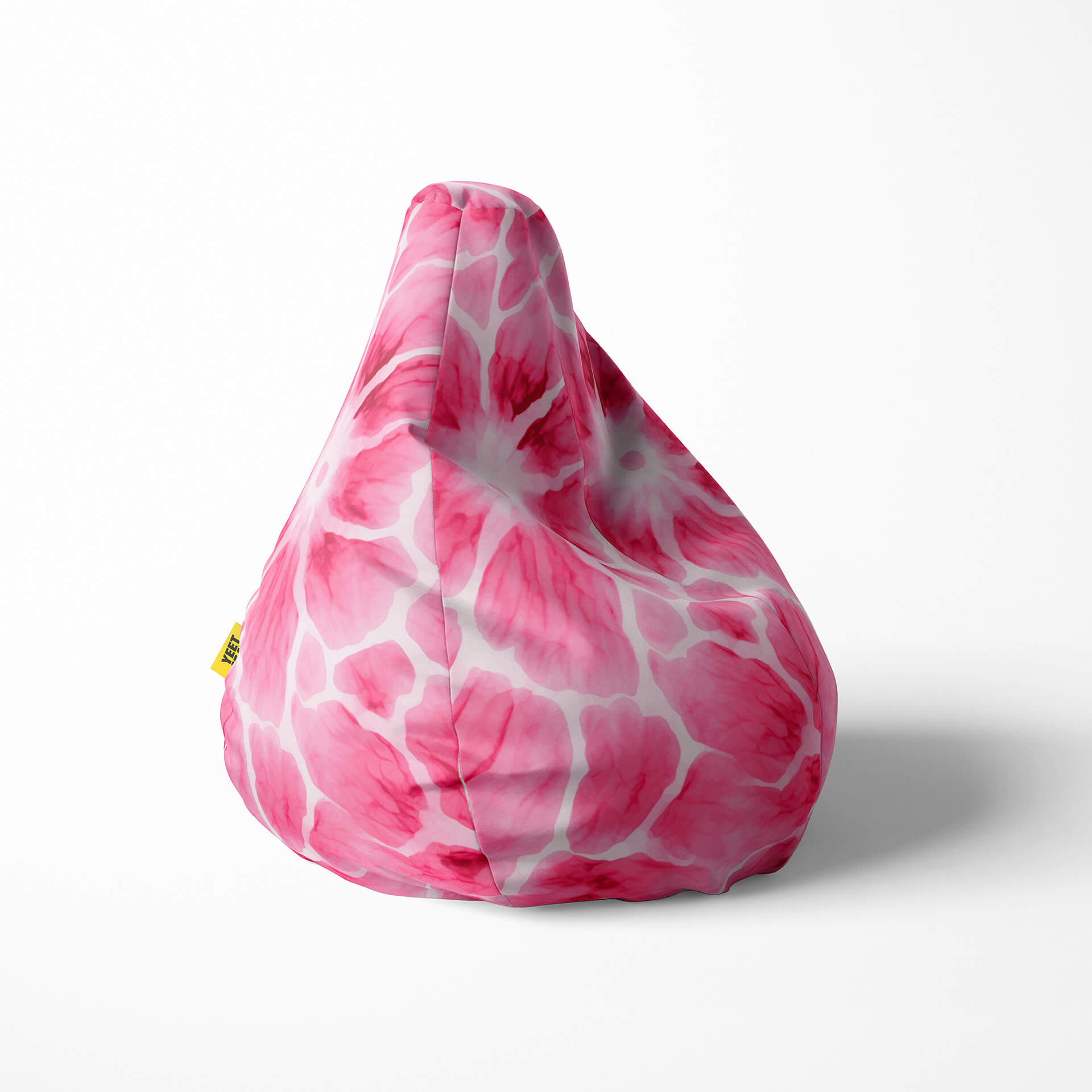 Right image of a beanbag with a pink and white floral watercolor pattern.