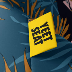 A vibrant Yeet Seat label on a bean bag side