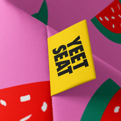 A vibrant Yeet Seat label on a bean bag side