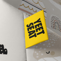 A vibrant Yeet Seat label on a bean bag side
