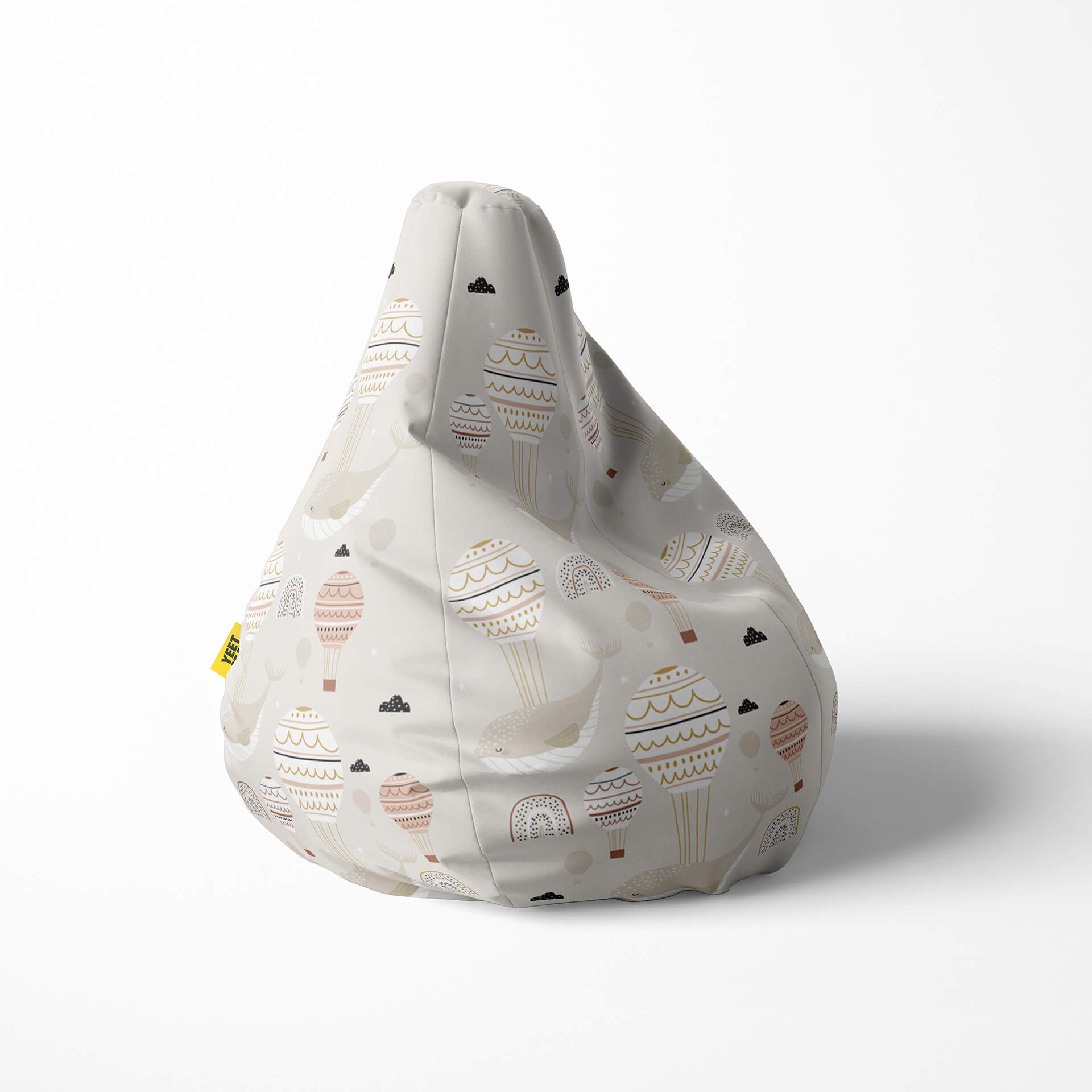 Right image of a beanbag with hot air balloons and clouds on a beige background.