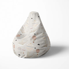 Left image of a beanbag with hot air balloons and clouds on a beige background.